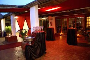 a room with two tables with candles in it at Rusplek Guesthouse and Conference Centre in Bloemfontein +136 photos