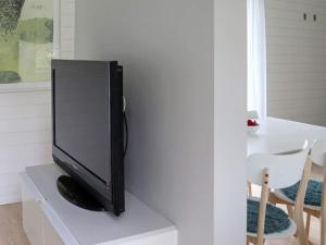 a flat screen tv sitting on top of a white table at 4 person holiday home in TRÄLÖVSLÄGE-By Traum in TrÃ¤slÃ¶vslÃ¤ge