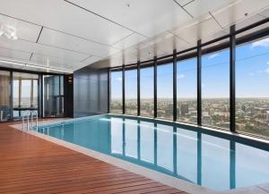 a swimming pool with a view of a city at Lvl30 Garden/River views Balcony by Stylish Stays in Brisbane