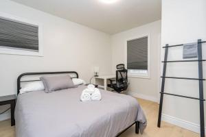a bedroom with a bed with a teddy bear on it at Cozy 4-Bdrm Pet-Friendly East Hamilton Escape in Hamilton