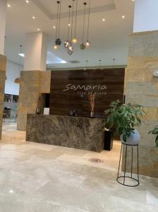 a lobby of a store with a counter in a building at Samaria - Apartamento en Club de Playa, Santa Marta in Santa Marta