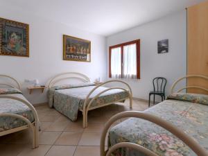 Voodi või voodid majutusasutuse Pleasant apartment in Aglientu with shared pool toas