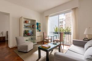 a living room with a couch and a table at Recoleta in Buenos Aires