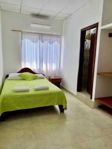 Voodi või voodid majutusasutuse Hostal Punta Arena toas