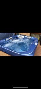 a blue tub filled with water sitting on top of a table at Luxury Apartments In Top City Center Varna 1 in Varna City