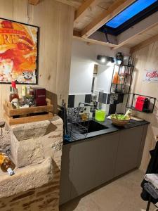 a kitchen with a counter top in a room at holiday home Chateau Castelnau in Prudhomat