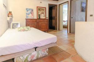a bedroom with a bed and a tiled floor at Apartment in the heart of Le Cannet with AC TERRACE BENAKEY in Le Cannet +12 photos