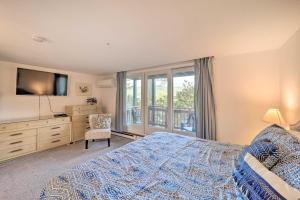 a bedroom with a bed and a tv and a window at Walk to Ski Resort Sugar Mountain Haven with Views! in Sugar Mountain