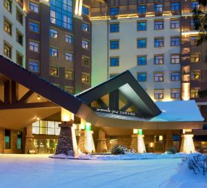 a hotel in the snow in front of a building at Wanda YUE Changbaishan in Baishan