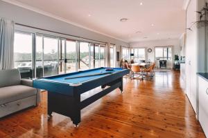 a living room with a pool table in it at Cooranbong Farm Stay-7 Bedrooms Cottage with Pool and Tennis Court in Cooranbong