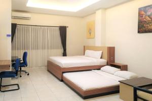 Ένα ή περισσότερα κρεβάτια σε δωμάτιο στο TwoSpaces Living at Residence 6 +11 φωτογραφίες