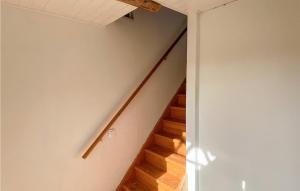 a staircase in a house with wooden floors at 2 Bedroom Beautiful Home In Braås in Braås
