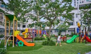 a park with children playing on playground equipment at Thủy Hạ Long Homestay in Ha Long