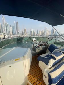 a deck of a boat with a view of a city at Yacht( boat )2 Beds, 1 Bath Dubai Eye Marina JBR in Dubai