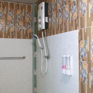 a shower stall in a bathroom with a shower at Phusam Big Resort in Koh Mook