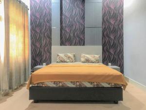 Katil atau katil-katil dalam bilik di Edotel SMKN 2 Pinrang Mitra RedDoorz