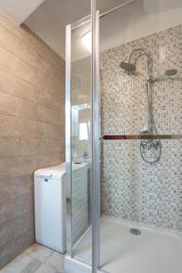 a bathroom with a shower and a toilet at Casa della Cava in Trogir