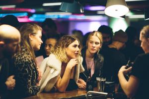 a group of people sitting at a table in a bar at Generator Stockholm in Stockholm