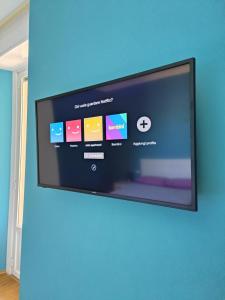 A television and/or entertainment centre at Amio Apartment - next to M5 Ca Granda