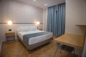 Posteľ alebo postele v izbe v ubytovaní OIKOS APARTAMENTOS TURÍSTICOS + 37 fotografií
