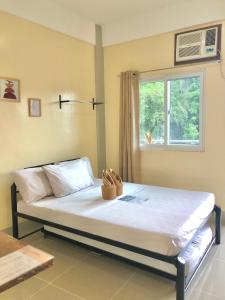 Postel nebo postele na pokoji v ubytování Hanna's Inn, El Nido