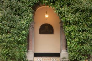 an entrance to a building with an ivy covered wall at Loch Ness Country House Hotel in Inverness