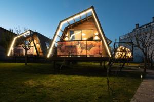 a house with lights on it in the grass at Xanelas Do Monte in Mos