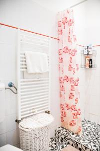 a bathroom with a shower curtain and a toilet at Stylish and Spacious ! Central location Kazincy Netflix in Budapest