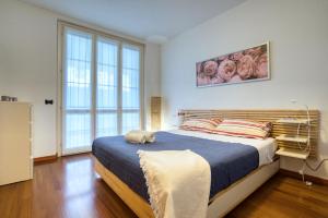 Llit o llits en una habitació de CaseOspitali - CASA INDACO bilocale con ampio giardino