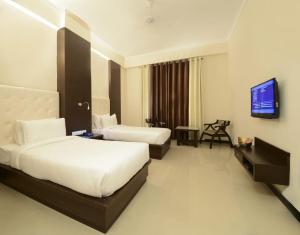 TV a/nebo společenská místnost v ubytování Hotel Crimson Palace