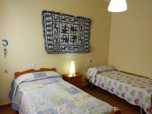 Postel nebo postele na pokoji v ubytování Casa Rural Almécija