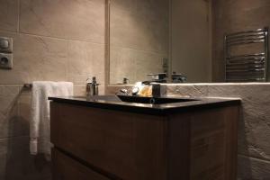 a bathroom with a sink and a large mirror at C056-Cannes Rue Antibes - Studio in Cannes +5 photos