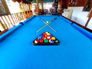 a pool table with balls in the middle at Hotel Oasis Port Barton in San Vicente