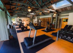 a gym with several treadmills and exercise bikes at Hana-Maui Resort, a Destination by Hyatt Residence in Hana