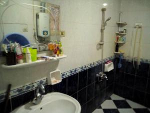 a bathroom with a sink and a mirror at غرفة خاصة الاسكندريه Sidi Bishr in Alexandria