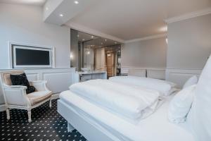 Postel nebo postele na pokoji v ubytování Boutique Hotel am Rathaus - Reblaus