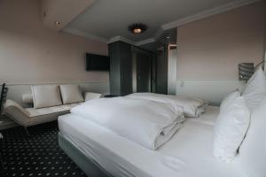 Postel nebo postele na pokoji v ubytování Boutique Hotel am Rathaus - Reblaus