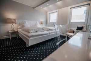 Кровать или кровати в номере Boutique Hotel am Rathaus - Reblaus