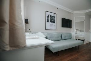 TV a/nebo společenská místnost v ubytování Boutique Hotel am Rathaus - Reblaus