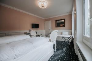 Postel nebo postele na pokoji v ubytování Boutique Hotel am Rathaus - Reblaus