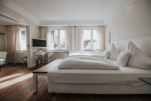 Postel nebo postele na pokoji v ubytování Boutique Hotel am Rathaus - Reblaus
