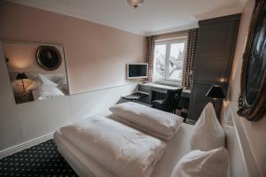 TV a/nebo společenská místnost v ubytování Boutique Hotel am Rathaus - Reblaus