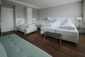 Postel nebo postele na pokoji v ubytování Boutique Hotel am Rathaus - Reblaus
