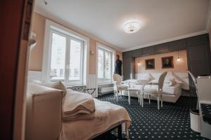 Postel nebo postele na pokoji v ubytování Boutique Hotel am Rathaus - Reblaus
