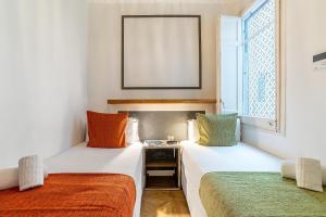 Posteľ alebo postele v izbe v ubytovaní Casa Gracia Apartments