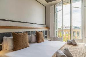 Posteľ alebo postele v izbe v ubytovaní Casa Gracia Apartments