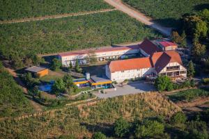 an aerial view of a farm with a building at Hôtel du Bollenberg - Restaurant "Côté Plaine" - Spa de la Colline in Westhalten