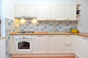 Kuchyňa alebo kuchynka v ubytovaní Apartment Prostin 1168