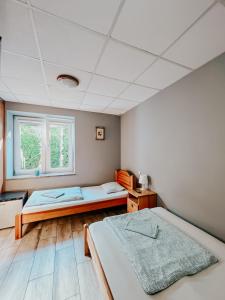 Posteľ alebo postele v izbe v ubytovaní Hostel Filip
