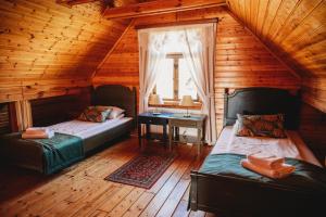 Posteľ alebo postele v izbe v ubytovaní Skansen Bicz Resort